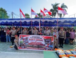 Ditreskrimsus Polda Kepri Bagikan dan Pasang Ratusan Bendera Merah Putih, Salurkan Sembako ke Warga